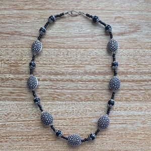 Necklace in Black and Silver tone beads with designs